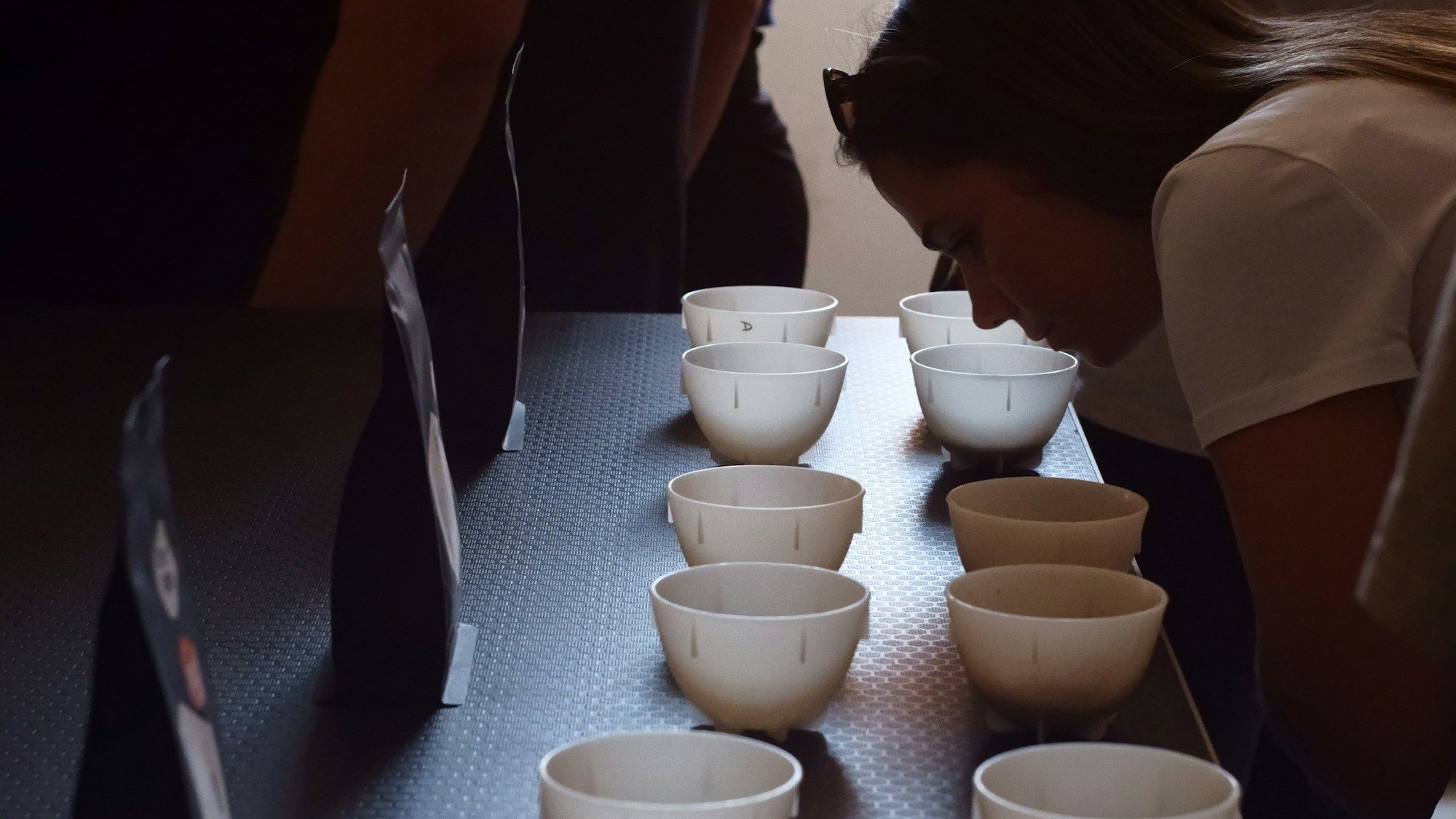 Sake being poured into a ceramic cup